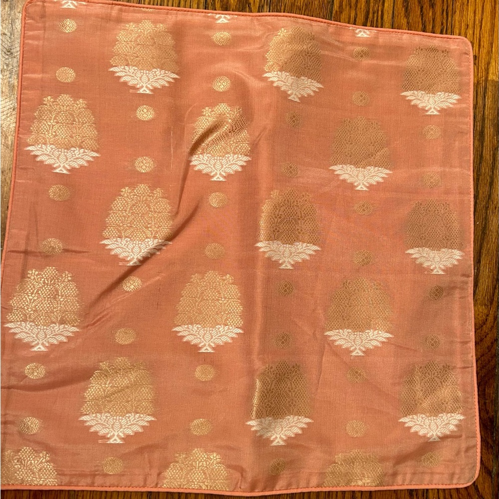 Patterned pillow cover in peach and gold